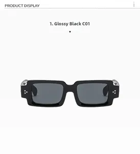 Close-up of black rectangular sunglasses with three silver rivets on the frame corner