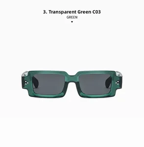 Detail of transparent green square sunglasses with silver rivets and grey lenses