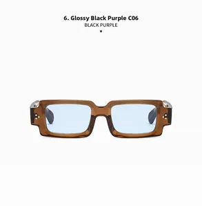 Detail view of rectangular sunglasses with amber frame and light blue lenses