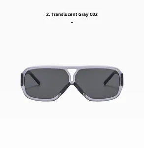 Detail shot of the transparent grey oversized flat top sunglasses with integrated dark lenses