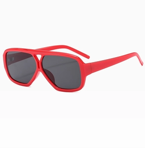 Detail of red square double-bridge sunglasses with dark grey lenses and vintage frame