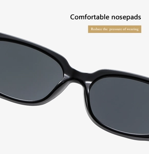 Close-up of ergonomic integrated nose pads on black minimalist square sunglasses