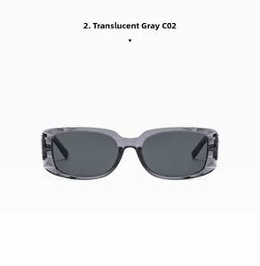 Detail view of translucent grey square sunglasses with textured frames and smoke lenses