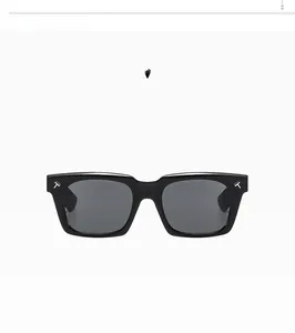 Detailed front view of square black sunglasses with metallic T-shaped accents on frames