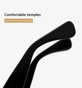 Macro view of black wide sunglasses temples with curved ends for non-slip comfort