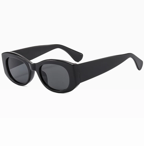 Detail view of thick black cat-eye frames and durable metal hinges on vintage sunglasses