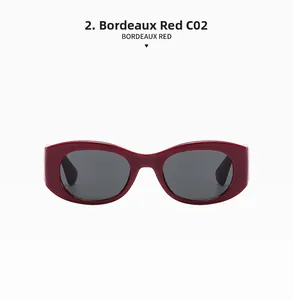Detail view of Bordeaux Red sunglasses with flat oval frames and dark grey lenses