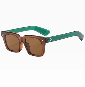 Close-up of square sunglasses showing silver hammer rivets and internal model ZN3818 text
