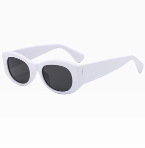 Detailed side view of vintage white thick-framed square sunglasses with dark oval lenses