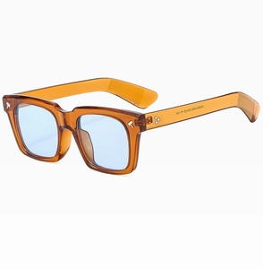 Detail of tortoise frame sunglasses with hammer rivets and blue tinted lenses