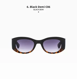 Close-up of black and demi retro cat eye sunglasses with purple gradient lenses
