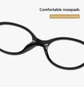 Close-up of comfortable integrated nose pads on black oval eyeglass frames