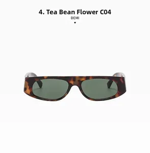 Detail view of retro narrow-frame sunglasses in tortoise shell finish with dark green lenses