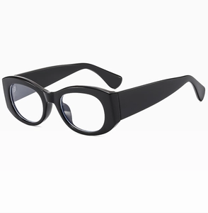 Detail of vintage thick-framed black cat eye sunglasses with wide temples and clear lenses