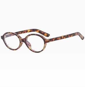 Detail view of oval tortoise shell eyewear frames with vintage texture at 45-degree angle