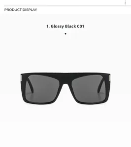 Detail of square black sunglasses with silver hinge metal accents and dark grey lenses