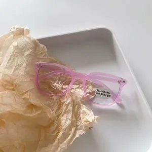 Detail of pink translucent frame kids sunglasses with anti-blue light and photochromic lens