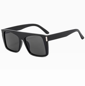 Detail view of square black sunglasses featuring elegant rectangular silver metal accents