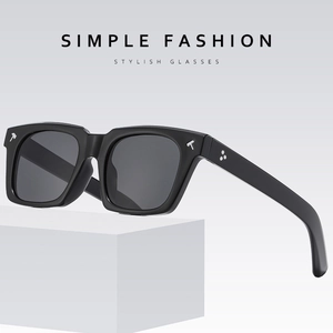 Chic black square frame sunglasses with silver T-shaped metal accents on white geometric stand