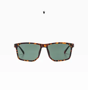 Detail view of demi brown square frame sunglasses with dark green polarized lenses