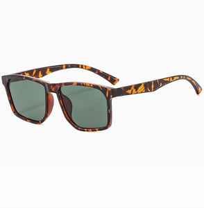 Detail view of square tortoiseshell frames with dark green lenses at a 45-degree angle