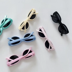 Retro kids sunglasses in six pastel colors featuring thick frames and vintage design