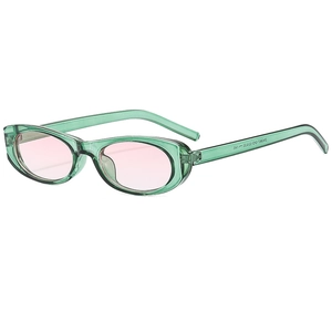 Retro oval sunglasses with green transparent frames and pink gradient lenses for women