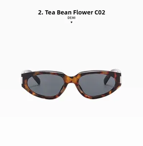 Detail of demi tortoise shell cat eye sunglasses with dark grey lenses and metal hinges