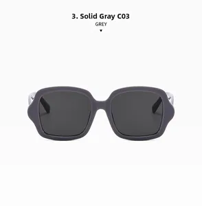 Détail de lunettes de soleil carrées oversize gris anthracite avec monture épaisse rétro