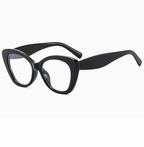 Close-up of elegant black cat-eye frames with clear lenses and polished finish