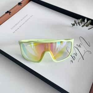 Detail view of mint green oversized sports sunglasses with colorful gradient mirror lenses