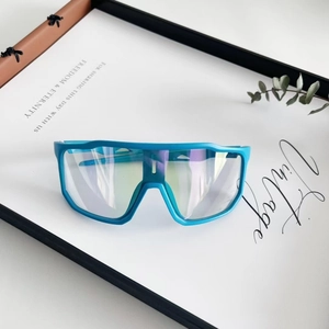 Detail of teal oversized sports goggles with colorful lenses and breathable air holes