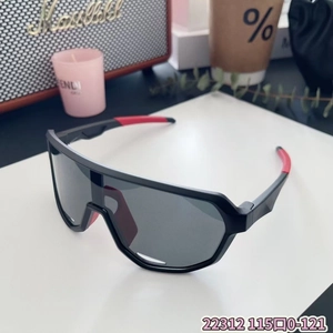 Detail of kids sports sunglasses with black wraparound lens and red anti-slip temple tips