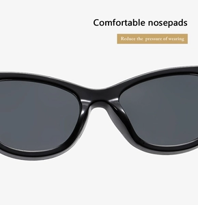 Detail of comfortable integrated nosepads on sleek black sunglasses for reduced pressure