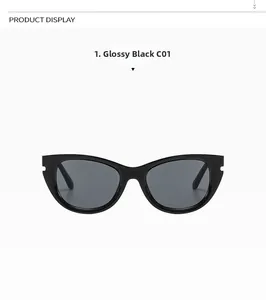 Close-up of bright black cat eye sunglasses with stylish frame notches and dark grey lenses