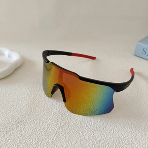 Detail view of sport cycling sunglasses featuring rainbow mirrored lenses and red-black frame