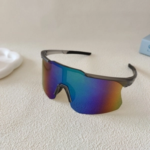 Close-up of polarized cycling sunglasses with a gradient lens and translucent grey frame