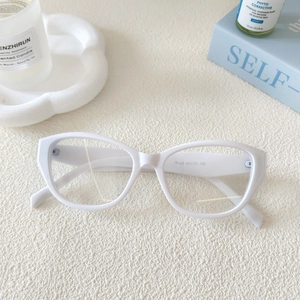 Close-up of white cat-eye sunglasses temple showing size specifications and model number