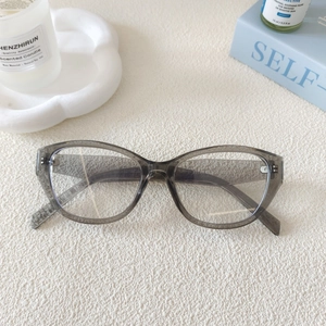 Detail view of transparent grey cat-eye frames with 53-20-137 size marking