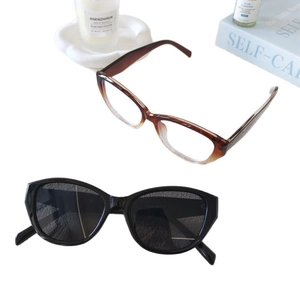 Retro cat-eye sunglasses for women and men featuring vintage brown and black frames