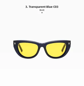 Detail of transparent blue cat-eye sunglasses with yellow lenses and metal rivets
