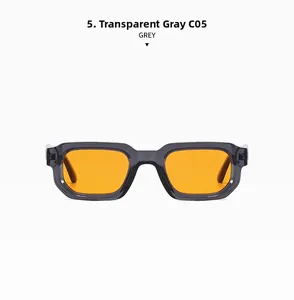 Detail of transparent grey frame with bright orange lenses on retro square sunglasses