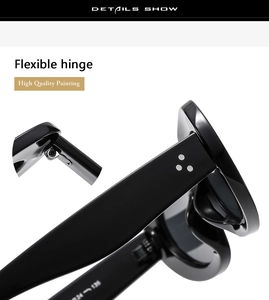 Detail of high quality flexible hinge and silver rivets on black oval sunglasses