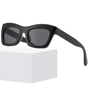 Lunettes de soleil œil-de-chat noires modernes avec monture épaisse pour femmes