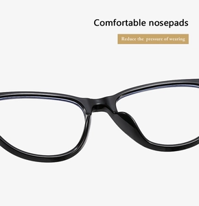 Close-up of integrated black nose pads on stylish cat-eye glasses for comfort
