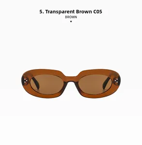 Macro shot of transparent tea retro oval sunglasses featuring metallic rivet details
