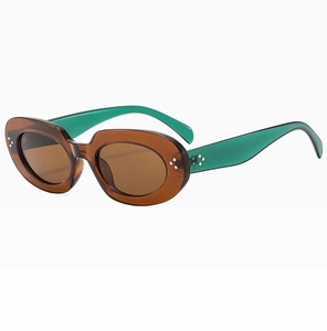 Detail of amber oval sunglasses with green temples and three-point silver rivets