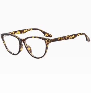 Detail of tortoise shell cat-eye glasses frame with clear lenses and glossy finish