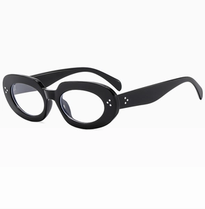 Detail of vintage oval black glasses featuring silver triple rivet studs on the frame side