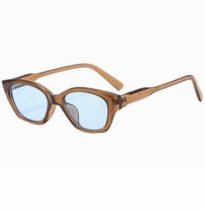 Detail view of JN3885 amber cat-eye sunglasses with light blue lenses and side frame texture